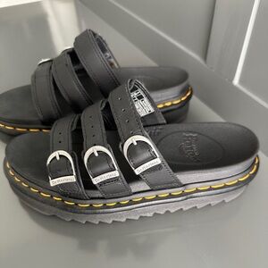 Dr. Martens Black Slide Sandals with Silver Buckles